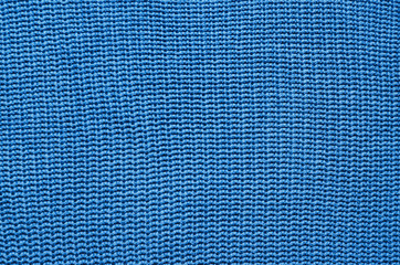 Blue knitted cotton sweater texture background. Space for copy, text, lettering.