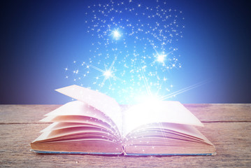 Abstract magic book on wooden background