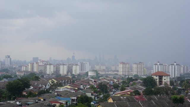 Time lapse view of downtown Kuala Lumpur, Malaysia with Petronas Twin Towers as the highest peak in the middle of it.