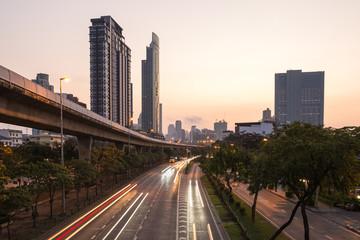 Fototapeta na wymiar bangkok cityspace and speed train at sunrise