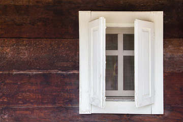 White window on wooden house 