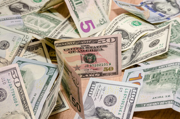 different US Dollar and Euro bills on table