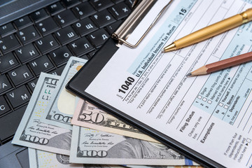 Obraz premium tax form 1040 with laptop