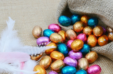 colorful egg chocolate on sack background