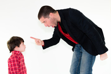 Obraz premium portrait of angry father scolding his son pointing finger, isolated on white background