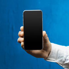 Businessman holding smartphone