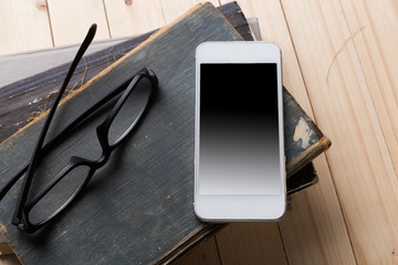 Composition with glasses and books on the table