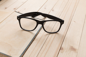 Composition with glasses and books on the table