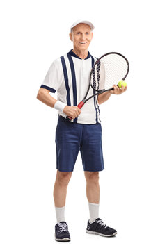 Senior man holding a racket and a tennis ball