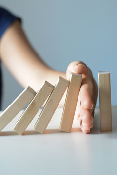 Stopping the domino effect concept with a business solution and intervention