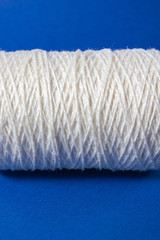 White thread isolated on white background. Rope, wool, knitting homemade handmade object.