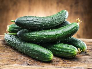 Cucumbers on the wooden table.