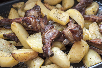 Grilled pork ribs with baked potatoes