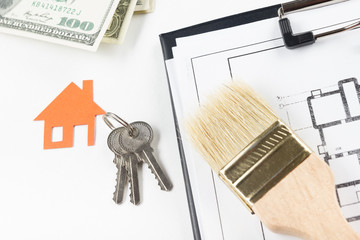 Model house, construction plan for house building, keys. Real Estate Concept. 