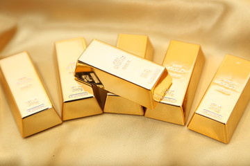 Gold bullion  isolated on gold cloth
