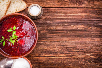Bowl of red beetroot soup. Background.