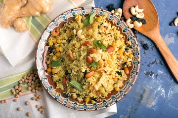 Cercles muraux Plats de repas Traditional dish of rice (pilaf) cooked with spices