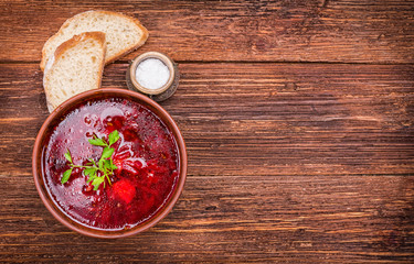 Fototapeta na wymiar Bowl of red beetroot soup. Background.