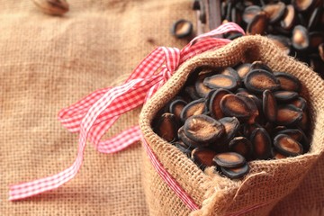 Watermelon seed of delicious on wood background.