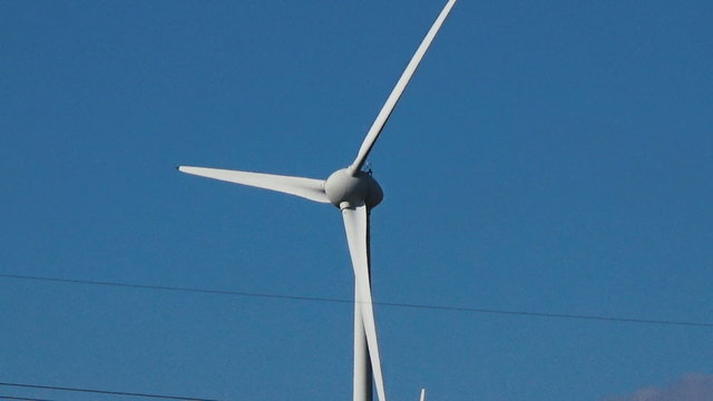 Zoom out close to extremely long shot of wind power park clean eco energy