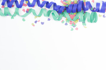 confetti and streamers on white background