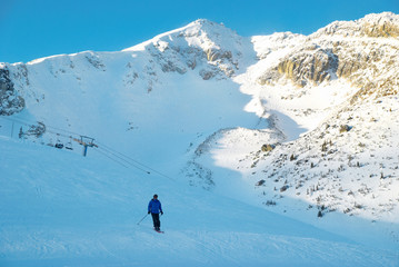 Naklejka na ściany i meble Skier on the mountain slope