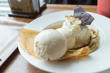 Crepe with ice cream and banana burned topping
