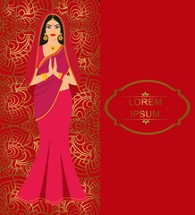 Beautiful Indian brunette young woman in colorful sari.