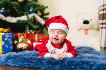Fototapeta na wymiar Baby dressed in Santa Claus