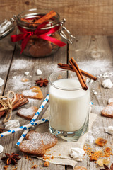 Glass of milk on a rustic wooden table