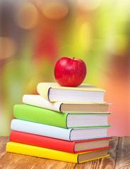 Back to school september holiday background stack books apple.