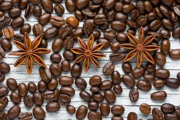 Coffee beans, cinnamon and star anise on white background 