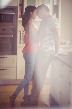 Love couple kissing in the kitchen