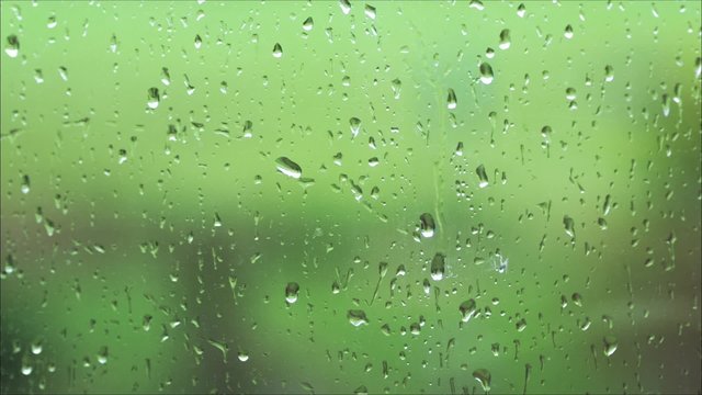 Raindrops on a window with one raindrop slowly moving down - 29.97FPS NTSC