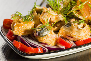 Herring rolls in oil and onions