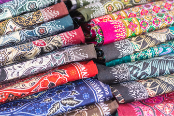 various weaving techniques, close up of colorful printed rolls o