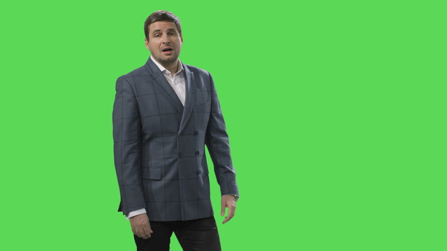 Woman is working with a virtual interactive interface on a mock-up green screen in the background. Shot on RED Cinema Camera.