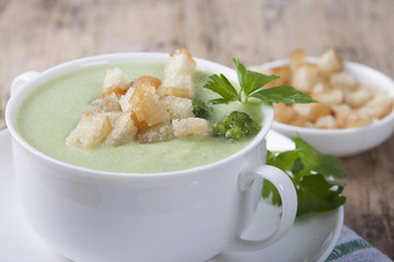 Cream of broccoli with croutons and parsley