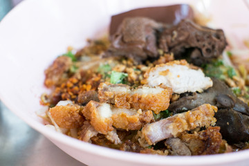 closeup crispy pork with boiled duck and noodle