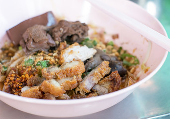 closeup crispy pork with boiled duck and noodle