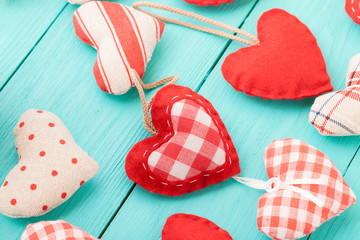 Hearts on blue wooden background. Valentines day. Top view and selective focus