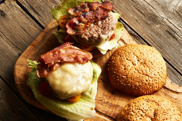 Home made cheeseburgers on wooden table
