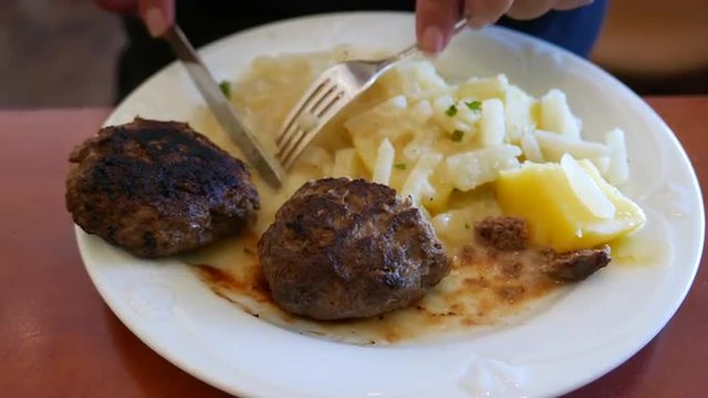 Close up of eating traditional meat with potatoes and vegetables. This soft food is suitable for seniors.