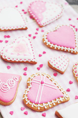 Pastel colored sugar cookies for valentines day on white plate