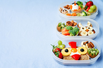 school lunch box for kids with food in the form of funny faces