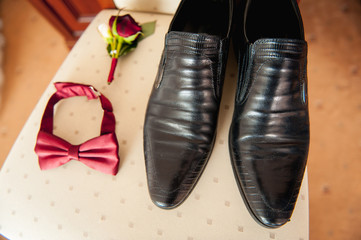 groom set clothes. Wedding rings, shoes, cufflinks and bow tie