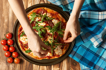 Home made pizza on wooden table