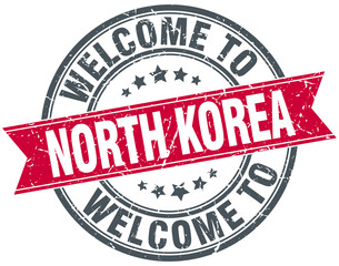 welcome to North Korea red round vintage stamp