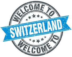 welcome to Switzerland blue round vintage stamp