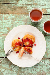 Syrniki, Russian cottage cheese pancakes with raspberry jam and